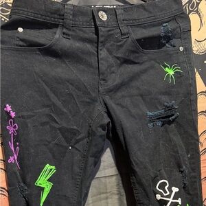 Zumiez Black Ripped Graphic Print Skinny
Jeans